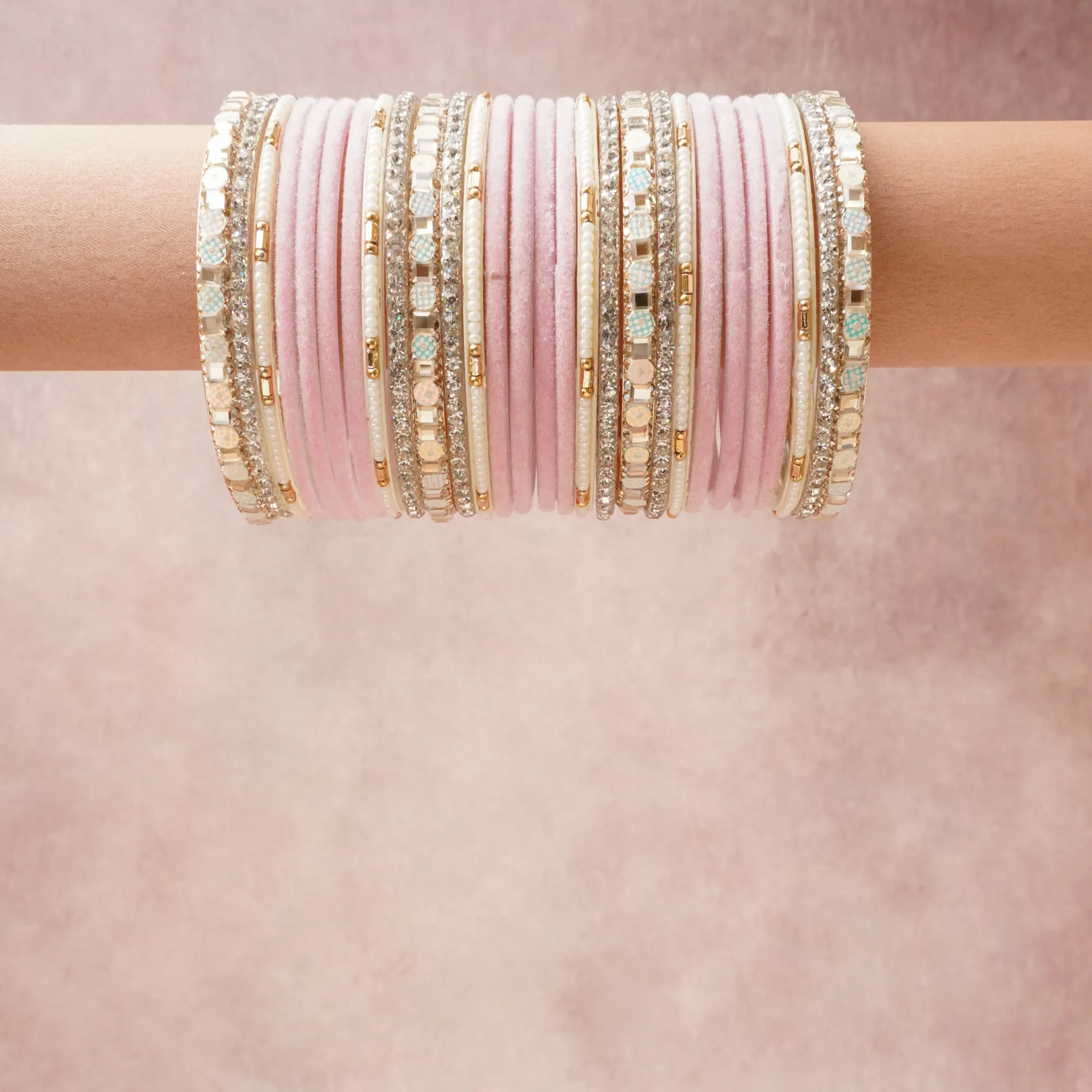 A grounding Blush Pink forms the heart of the set, while touches of Silver, Gold, Pale Aqua add charm.

A thoughtful composition of Velvet, Metal (Silver-toned, Gold-toned), Glass Rhinestones, Simulated Pearls, Glass Beads, Enamel, designed to feel complete without being heavy.
Each element layers seamlessly, creating a look that is refined, wearable and quietly striking.